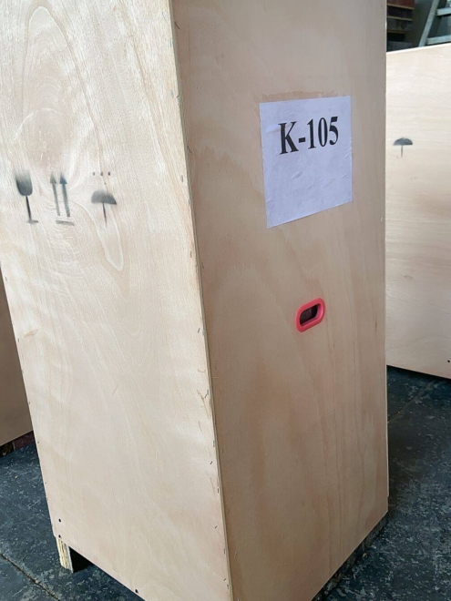 The sterilizer is placed in a wooden box and prepared for transportation.